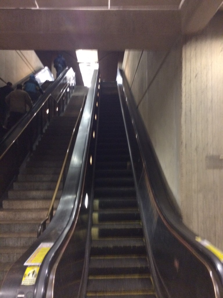 Inside Shady Grove Station escalator down. 